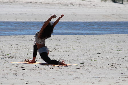 woman doing aerobics beside water during daytime thumbnail