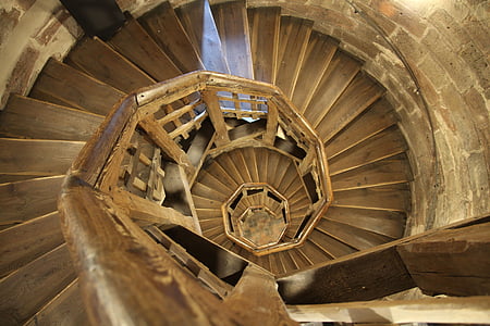 shallow focus photo of brown wooden spiral stairs thumbnail