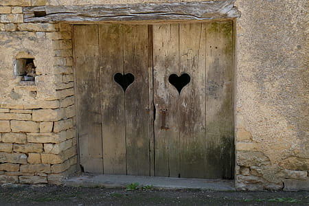 front view of closed brown wooden door thumbnail