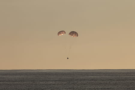 parachute above body of water thumbnail