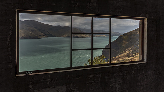 landscape photo of body of water with mountains thumbnail