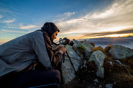 man taking a photo of rocks thumbnail
