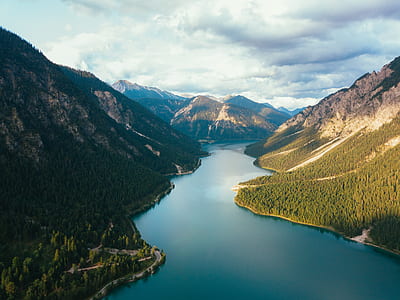aerial photography of river between mountains thumbnail