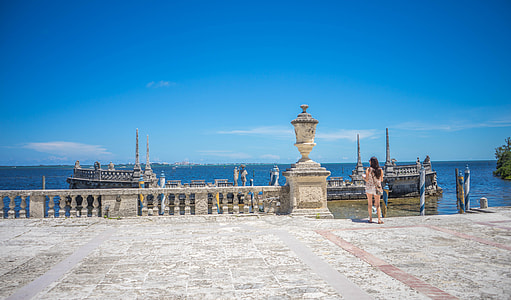 woman standing on baby near body of water during daytime thumbnail