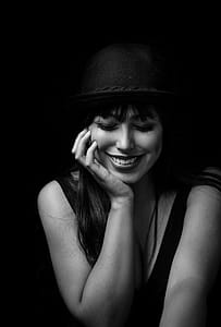 Grayscale Photography of Smiling Woman Putting Hands on Face thumbnail