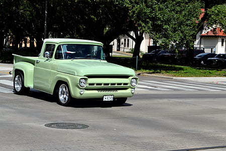 green truck on road thumbnail