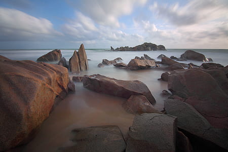 Rocks in Sea during Daytime thumbnail