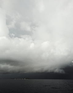 body of water under cloudy sky thumbnail