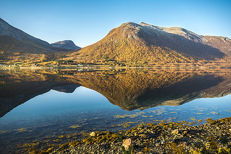 Landscape Photo of Mountains and Body of Water thumbnail