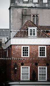 brown and white brick house thumbnail