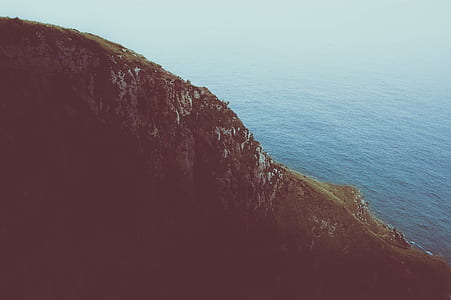 landscape photography of mountain beside body of water thumbnail