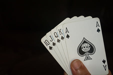 person holding playing cards thumbnail