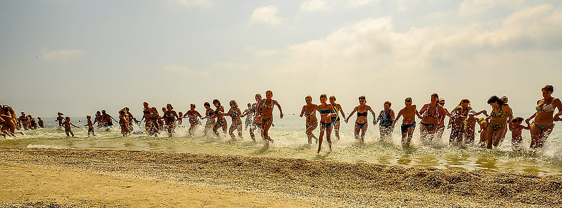 people running on sea at during daytike thumbnail