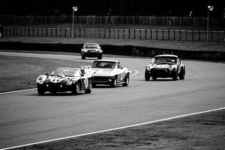 grayscale photogray of four assorted cars thumbnail