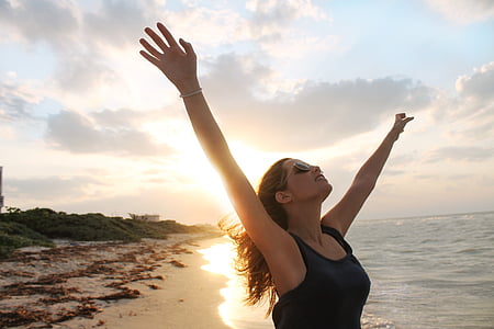 woman wearing black tank top in the beach thumbnail