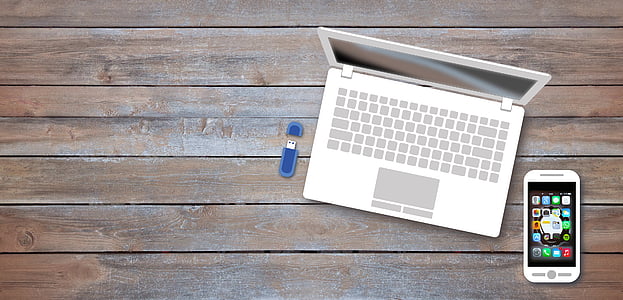 gray laptop computer and Android smartphone on top of table thumbnail