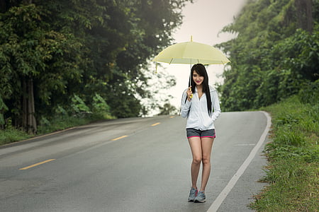 woman holding umbrella thumbnail