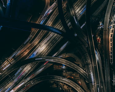 aerial time-lapse photography of vehicles on a multi-level highway crossing thumbnail