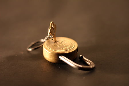 gold-colored padlock with grey metal key thumbnail