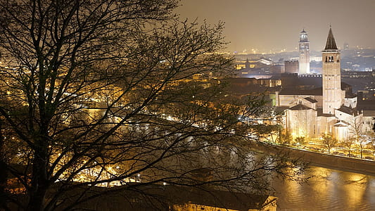 aerial view of lighted city buildings at night thumbnail