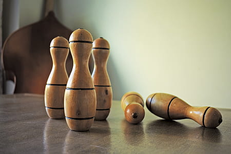 brown wooden condiment mills on table thumbnail