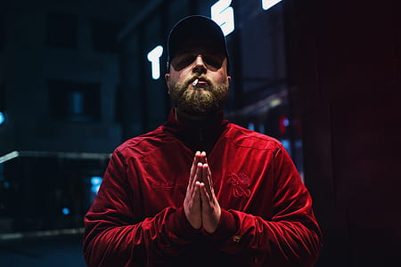 man with cigarette on his mouth while doing praying hand thumbnail