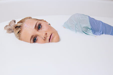 woman in white colored liquid thumbnail