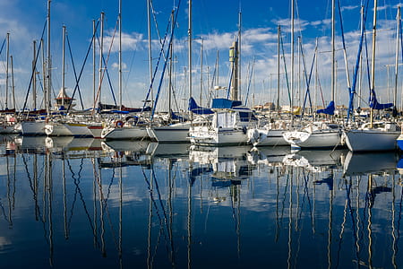 white sailing boats on water thumbnail