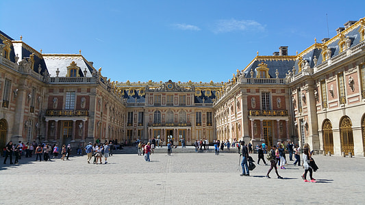 group of people walking in front of castle thumbnail