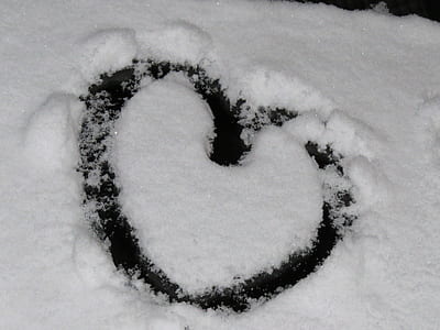 close-up photo of snow with heart formation thumbnail