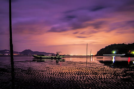 white speed boat on body of water thumbnail