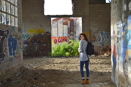 woman inside ruined structure thumbnail