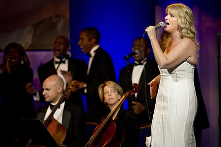 woman singing near orchestra thumbnail