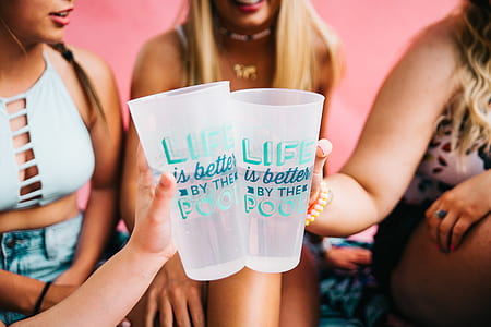 photo of two women holding drinking glasses thumbnail
