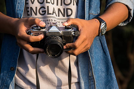 Person Holding Black Dslr Camera thumbnail