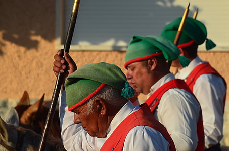 men holding black stick thumbnail