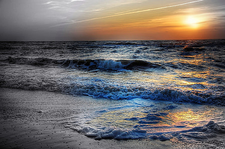 ocean wave taken at sunset thumbnail