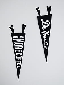 two black-and-white flags on white painted wall thumbnail