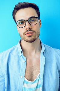 man in blue dress shirt wearing black framed eyeglasses thumbnail