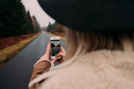 woman taking photo of road thumbnail