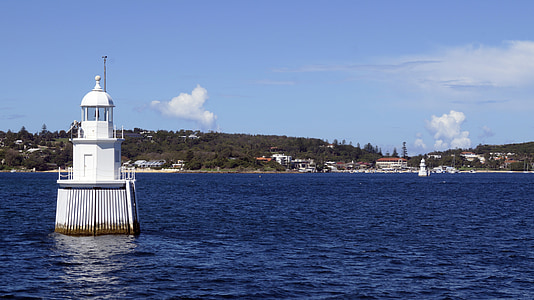 white watch tower in body of water thumbnail