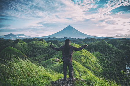Person Standing on Top Of Hill thumbnail