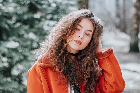 Woman In Orange Zip Up Jacket Photo thumbnail
