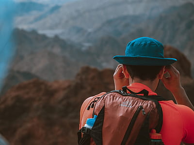 man wearing backpack on mountain thumbnail