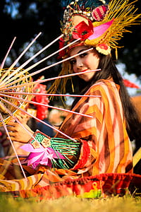 woman with traditional costume during daytime thumbnail