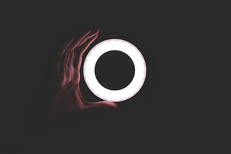 person holding round white decor thumbnail