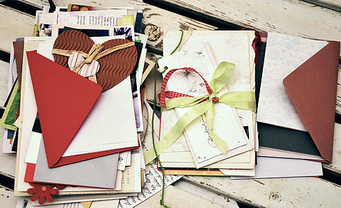 assorted envelopes on white wooden surface thumbnail
