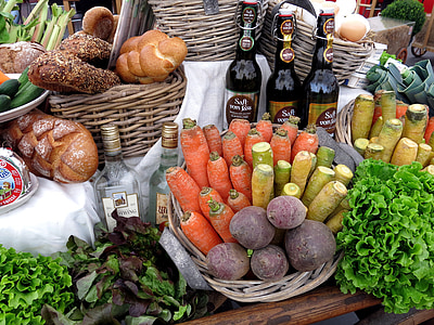 vegetables, pastries, and bottles on brown table thumbnail