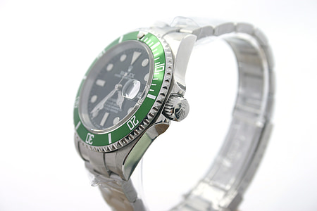 round green Rolex analog watch with link bracelet thumbnail