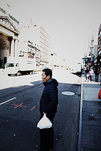 man holding white plastic bag thumbnail